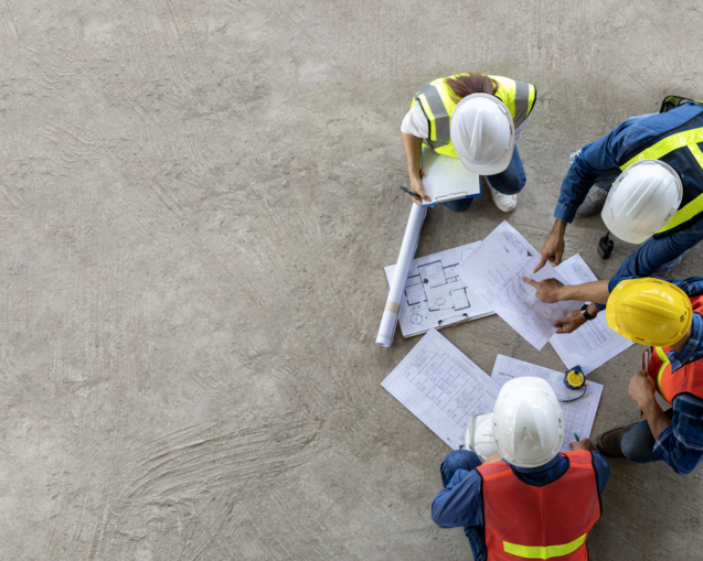 Top view of engineer, architect, contractor and foreman meeting at the construction building site with floor plan for real estate development project industry and housing timeline usage